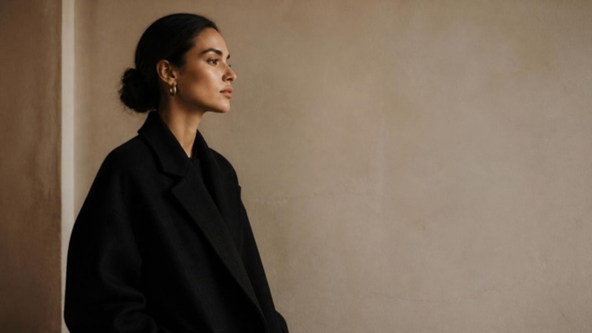 Model in a black wool coat